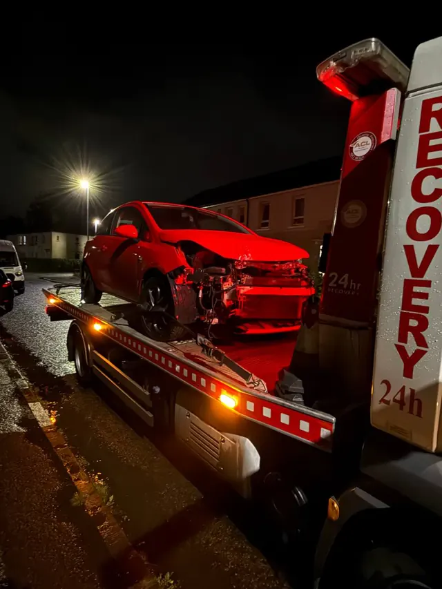 Front-damaged vehicle recovered at night