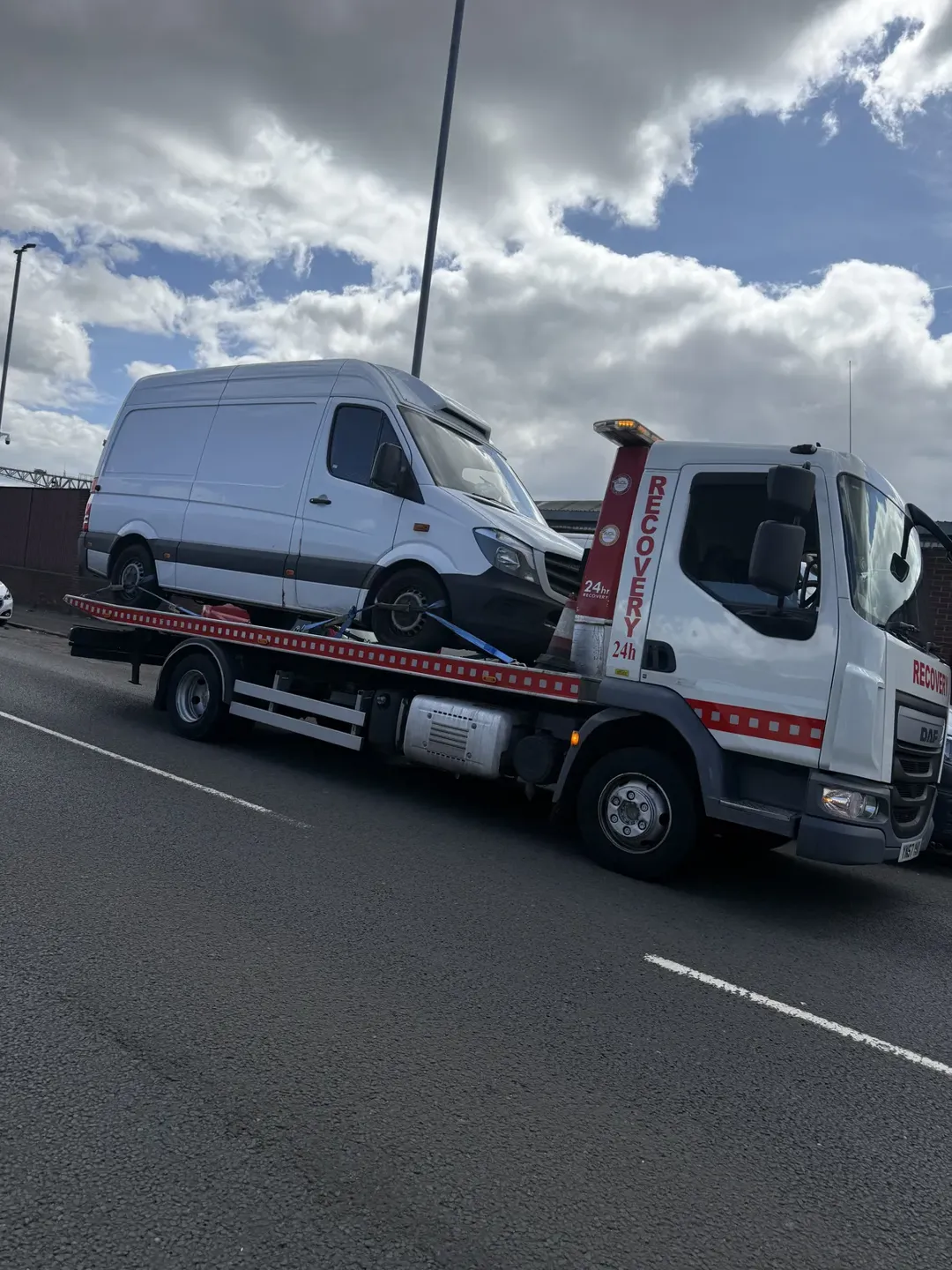 Panel van loaded on recovery truck