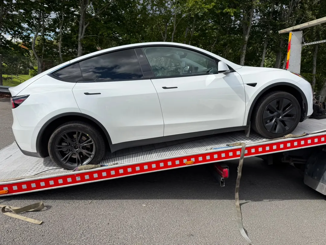 Tesla carried on a Lifesaver flatbed
