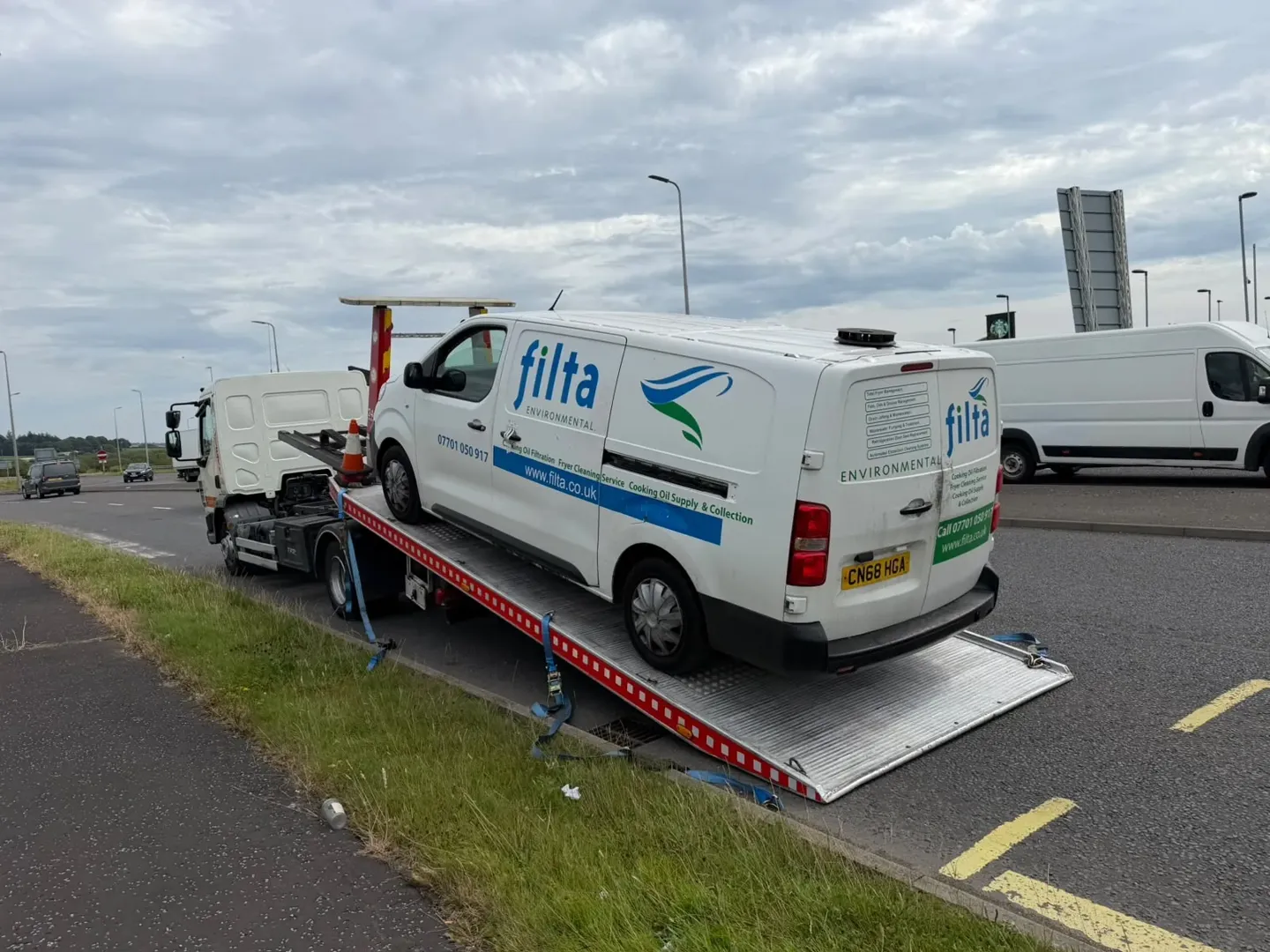 White commercial van loaded on Lifesaver tilt-and-slide recovery truck in Glasgow