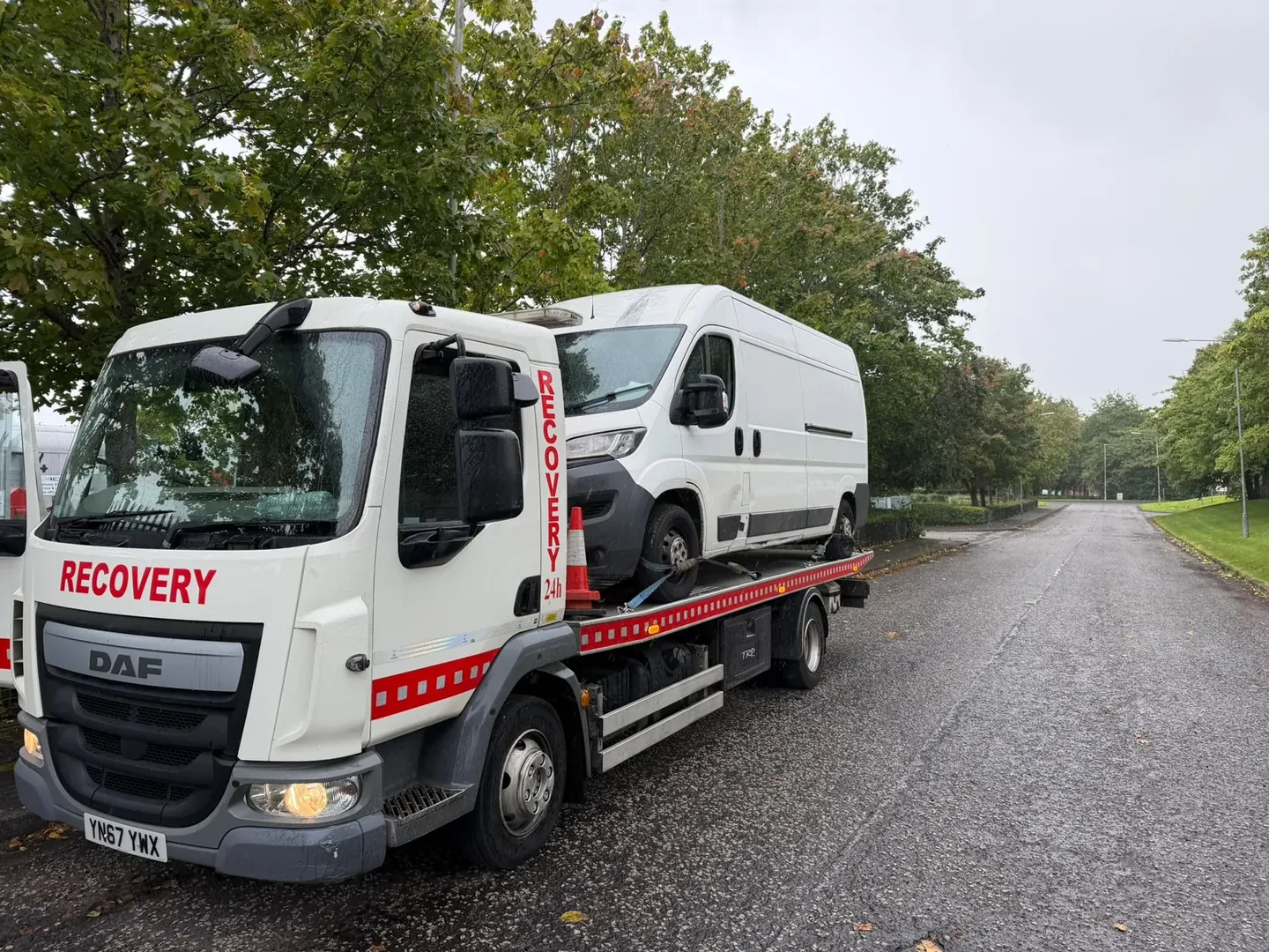 White panel van being transported by Lifesaver Vehicle Recovery in Glasgow